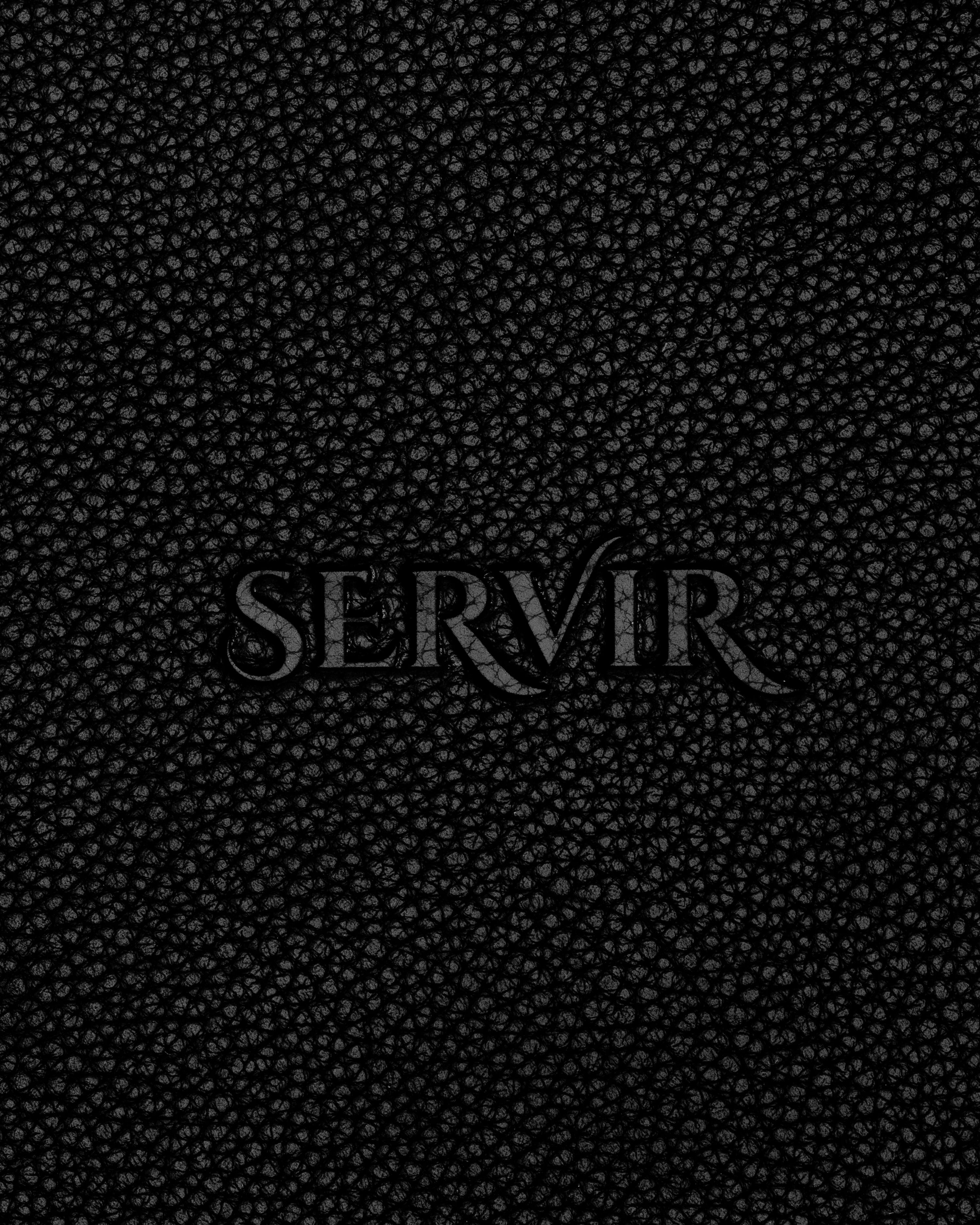 Debossed SERVIR logo on black recycled leather — SERVIR brand mark detail