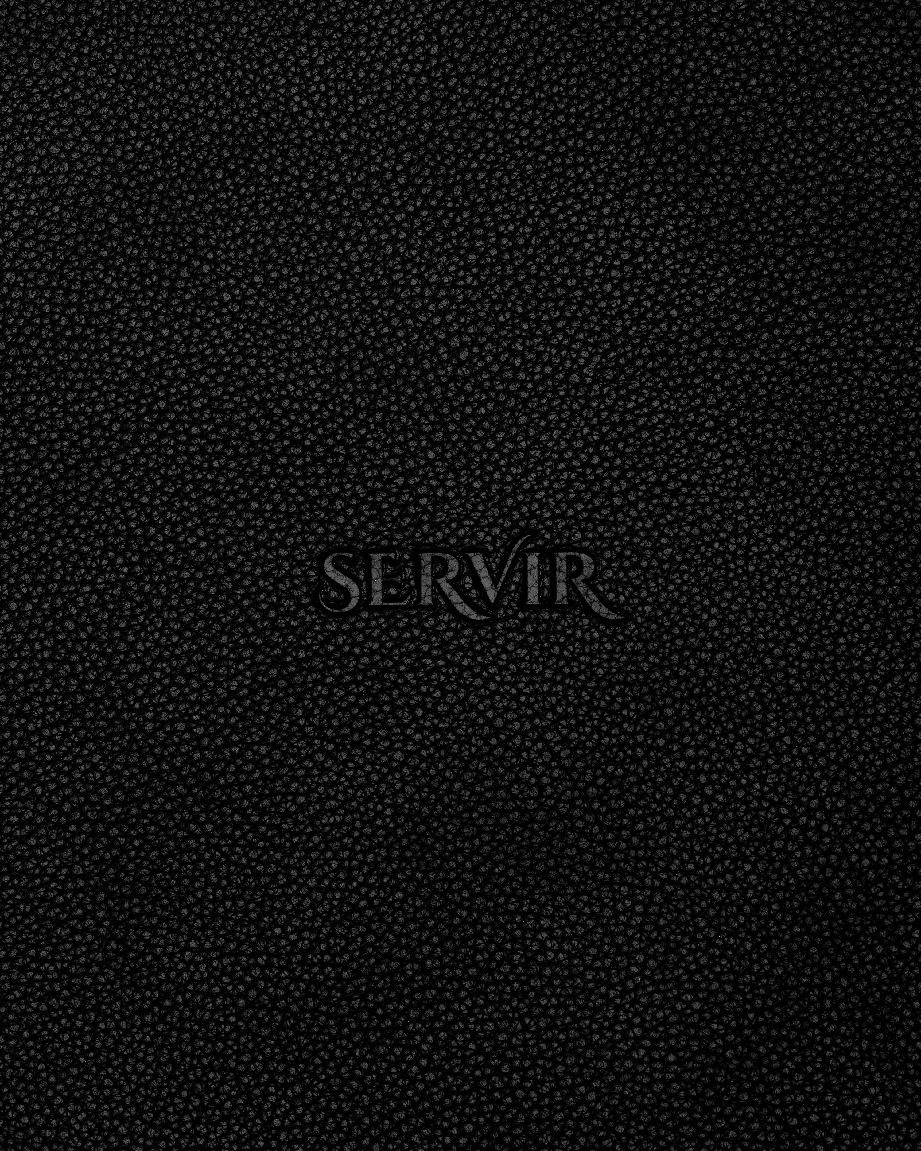 Debossed SERVIR logo on black recycled leather placemat reverse — leather grain texture detail