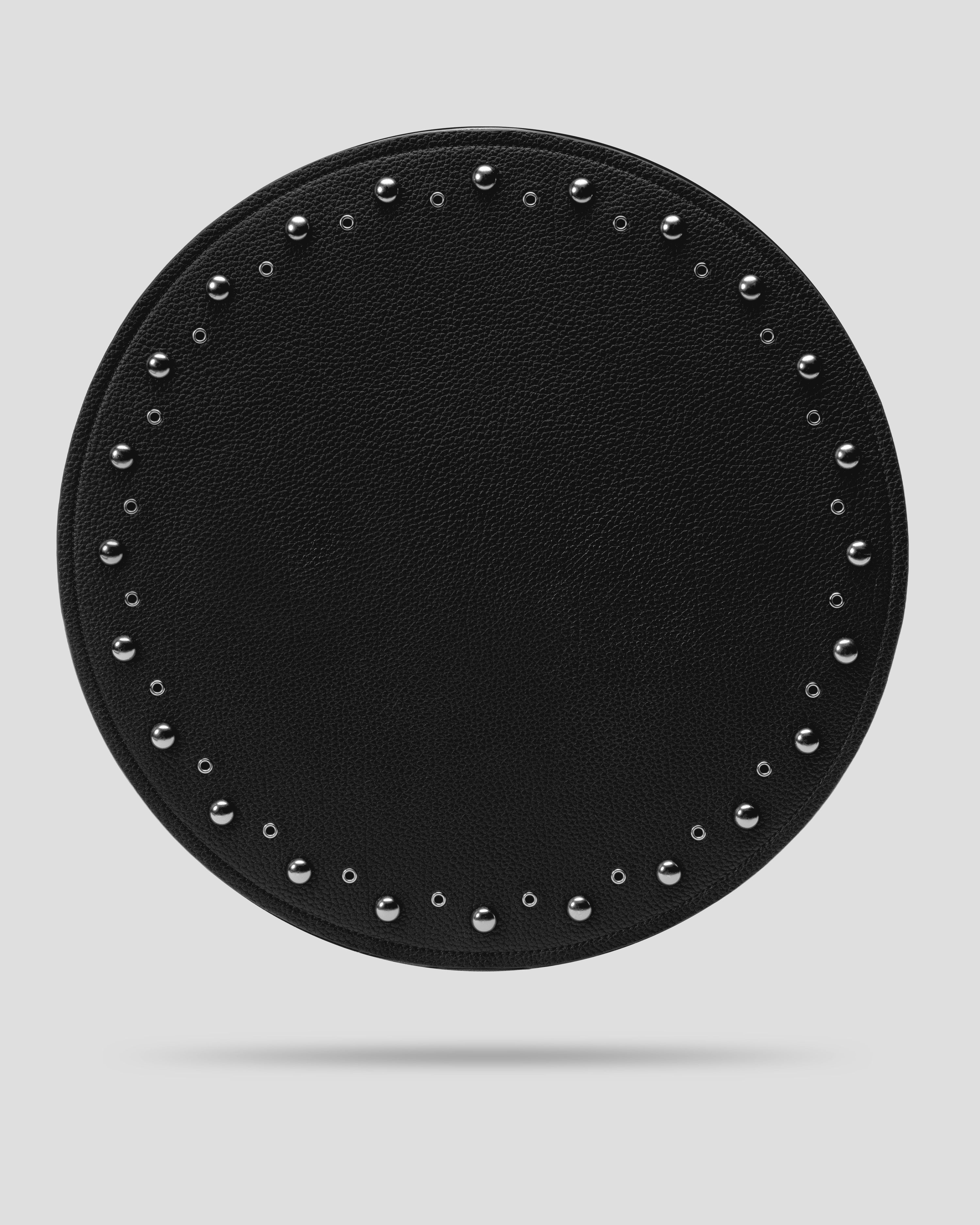 Black recycled leather placemat with silver dome studs and open eyelets, front view — SERVIR First Service